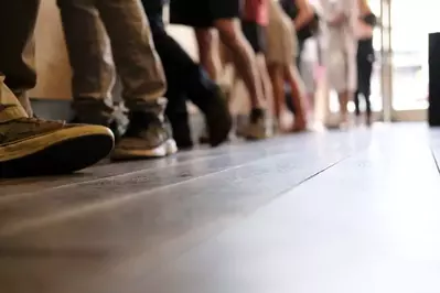 people waiting in line at a store