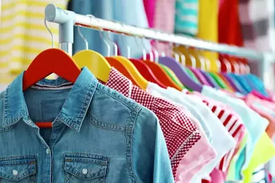 clothes hanging on rack in store