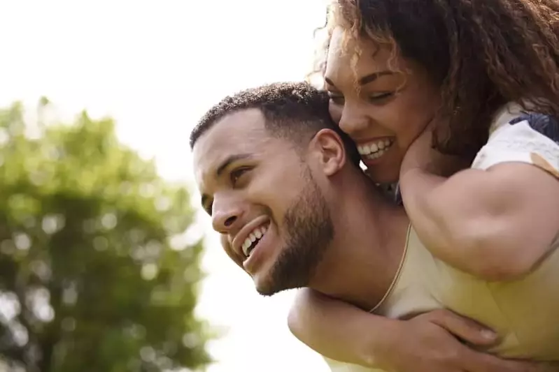 Happy couple in the woods.