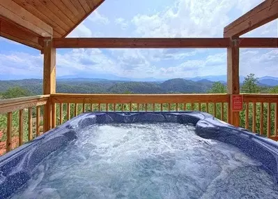 Hot tub on the deck of a cabin with mountain view near Pigeon Forge, Tennessee