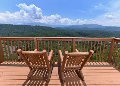 Chairs on the deck of the Amazing Views cabin rental.