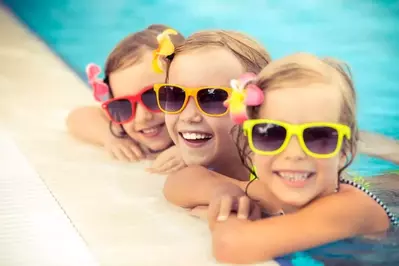 Kids swimming in a family friendly Pigeon Forge cabin with indoor pool