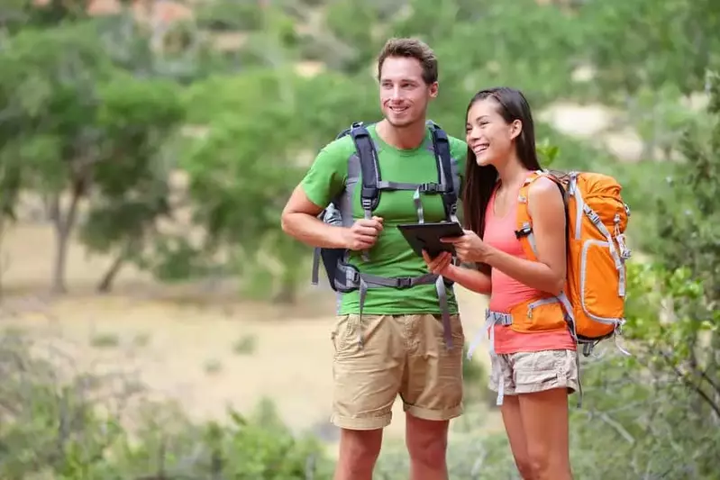 couple looking at a tablet to get around