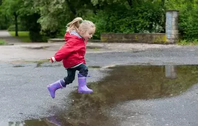 little kid enjoying a rainy day in the Smoky Mountains