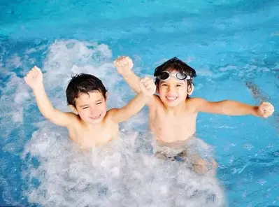 young boys having fun in a Gatlinburg cabin with indoor pool