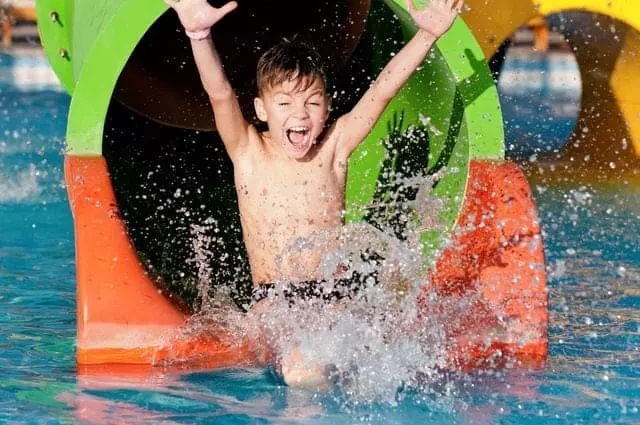 boy sliding down slide at Dollywood's Splash Country